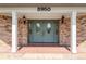 Close up of the home's front entrance showing the double doors and portico at 3950 Se 10Th Ln, Ocala, FL 34471
