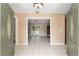 Bright foyer with tile flooring leading to a living area at 3950 Se 10Th Ln, Ocala, FL 34471