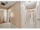 Hallway with tile flooring, closet doors, and neutral walls at 3950 Se 10Th Ln, Ocala, FL 34471
