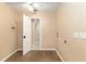 Laundry room with tiled floor, ceiling fan, and washer dryer hookups at 3950 Se 10Th Ln, Ocala, FL 34471