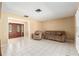 Cozy living room with tile flooring, neutral walls, and double door entry at 3950 Se 10Th Ln, Ocala, FL 34471