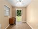 Office features a built-in desk, tile flooring, and a view of the backyard at 3950 Se 10Th Ln, Ocala, FL 34471
