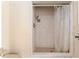 Shower with neutral tile, shower curtain, and a rainfall shower head at 3950 Se 10Th Ln, Ocala, FL 34471