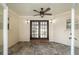 A sunroom provides a versatile space with a fan, tile flooring, and french doors that lead to outdoors at 3950 Se 10Th Ln, Ocala, FL 34471