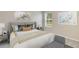 Serene bedroom with a large window, neutral decor, and a comfortable bed at 4235 Sw 53Rd Lane Rd, Ocala, FL 34474