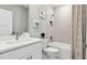 Modern bathroom with tiled shower-tub, neutral tones, and sleek fixtures at 4301 Sw 54Th Street Rd, Ocala, FL 34474