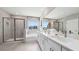 Bright bathroom with double sinks, a shower, a soaking tub, and large windows with a view at 4301 Sw 54Th Street Rd, Ocala, FL 34474