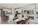 Well-lit kitchen and dining area featuring white cabinets, modern appliances, and a dining table at 4301 Sw 54Th Street Rd, Ocala, FL 34474