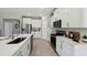 Contemporary kitchen featuring white cabinets, stainless steel appliances, and quartz countertops at 4301 Sw 54Th Street Rd, Ocala, FL 34474