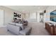 Spacious living area with a sectional sofa, neutral tones, and modern furnishings at 4301 Sw 54Th Street Rd, Ocala, FL 34474