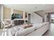 Inviting living room with a modern entertainment center, cozy seating, and neutral decor at 4301 Sw 54Th Street Rd, Ocala, FL 34474
