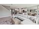 Expansive open-concept living area featuring a modern kitchen, dining space, and comfortable seating area at 4301 Sw 54Th Street Rd, Ocala, FL 34474