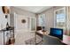Bright home office with glass doors, large windows, stylish decor, and a modern work desk at 4301 Sw 54Th Street Rd, Ocala, FL 34474