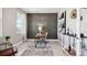 Elegant home office featuring a decorative paneled accent wall, a work desk, and natural light at 4301 Sw 54Th Street Rd, Ocala, FL 34474