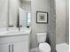 Well-lit bathroom with white cabinets, modern fixtures, and a shower-tub combination, offering a clean aesthetic at 4317 Sw 54Th Street Rd, Ocala, FL 34474