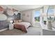 Stylish bedroom with a charming accent wall and a sunny window, creating a cozy, inviting retreat at 4317 Sw 54Th Street Rd, Ocala, FL 34474