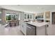 Modern kitchen with a center island, stainless steel appliances, and a dining area at 4317 Sw 54Th Street Rd, Ocala, FL 34474