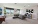 Spacious living room with large windows, comfortable seating, and stylish decor, perfect for relaxation at 4317 Sw 54Th Street Rd, Ocala, FL 34474
