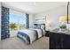 Cozy bedroom with large window, blue patterned curtains, and nautical-themed decor at 4746 Sw 88Th Ln, Ocala, FL 34476