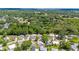 Sprawling aerial perspective of a serene community, surrounded by lush greenery and serene landscapes at 514 Saint Andrews Blvd, Lady Lake, FL 32159