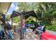 Inviting backyard patio with a covered gazebo and comfortable seating, perfect for outdoor relaxation at 514 Saint Andrews Blvd, Lady Lake, FL 32159