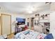 Comfortable bedroom featuring nautical decor, a ceiling fan, and a built-in desk at 514 Saint Andrews Blvd, Lady Lake, FL 32159