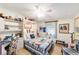 Cozy bedroom featuring a nautical theme and a built-in desk and shelving unit at 514 Saint Andrews Blvd, Lady Lake, FL 32159