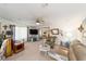 Spacious living room with neutral carpet, ceiling fan, and comfortable seating at 514 Saint Andrews Blvd, Lady Lake, FL 32159
