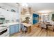 Open-concept space with kitchen, dining, and living areas, perfect for entertaining and modern living at 514 Saint Andrews Blvd, Lady Lake, FL 32159