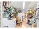 Well-stocked storage room with shelving, laundry machine and ample space at 514 Saint Andrews Blvd, Lady Lake, FL 32159