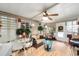 Bright sunroom with wicker furniture, glass tables, and decorative plants, perfect for relaxation at 514 Saint Andrews Blvd, Lady Lake, FL 32159