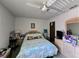 Bedroom with ceiling fan and plenty of natural light at 519 Fairways Cir # A, Ocala, FL 34472