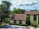 Well-maintained condo exterior featuring manicured landscaping and convenient guest parking at 519 Fairways Cir # A, Ocala, FL 34472