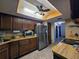 Bright kitchen featuring stainless steel appliances and wooden cabinets at 519 Fairways Cir # A, Ocala, FL 34472