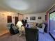 Comfortable living room with large window and sliding glass door at 519 Fairways Cir # A, Ocala, FL 34472