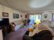 Cozy living room with carpet, natural light, and comfortable seating at 519 Fairways Cir # A, Ocala, FL 34472