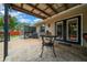Inviting back patio features tiled floors, a dining area, and an outdoor grill at 530 Sw 35Th St, Ocala, FL 34471