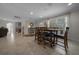 Bright dining area features a wooden table with chairs and neutral tile flooring, complemented by natural light at 530 Sw 35Th St, Ocala, FL 34471