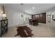 Open-concept dining room with modern lighting, stylish table, and neutral decor creates an inviting space for entertaining at 530 Sw 35Th St, Ocala, FL 34471