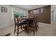 Dining room featuring an updated table, a window, and a decorative wall at 530 Sw 35Th St, Ocala, FL 34471