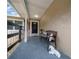 Covered front porch features a bench and charming decor, offering a welcoming entrance to the home at 530 Sw 35Th St, Ocala, FL 34471
