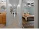 Hallway view to bathroom and bedroom featuring tile floors and serene blue walls at 530 Sw 35Th St, Ocala, FL 34471