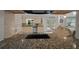 Stylish kitchen with granite countertops, tile backsplash, and stainless steel appliances at 530 Sw 35Th St, Ocala, FL 34471