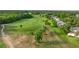 Aerial view of a golf course and a community with mature trees at 546 Midway Dr # B, Ocala, FL 34472