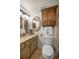 Bathroom showcasing double mirrors, vanity with sink, and a closed toilet at 546 Midway Dr # B, Ocala, FL 34472