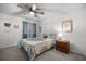 Relaxing bedroom offers carpet, blue accents, and a ceiling fan at 546 Midway Dr # B, Ocala, FL 34472