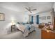 Bedroom showcasing a bright ceiling fan, neutral walls, and comfortable furniture at 546 Midway Dr # B, Ocala, FL 34472