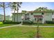 Charming two-story condo in a lush green community, featuring well-maintained landscaping and ample parking at 546 Midway Dr # B, Ocala, FL 34472