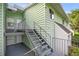 Exterior view of condo building showcasing well-maintained siding, stairs and entrances at 546 Midway Dr # B, Ocala, FL 34472