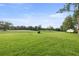 Expansive green space with mature trees and well-maintained lawns, perfect for outdoor activities at 546 Midway Dr # B, Ocala, FL 34472